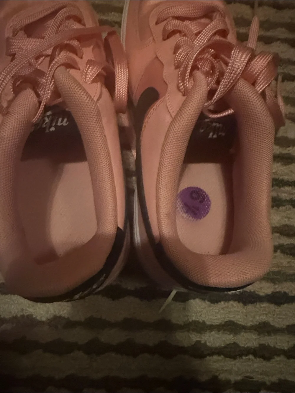 Nike Pink Low-Top Sneakers with Black Swoosh